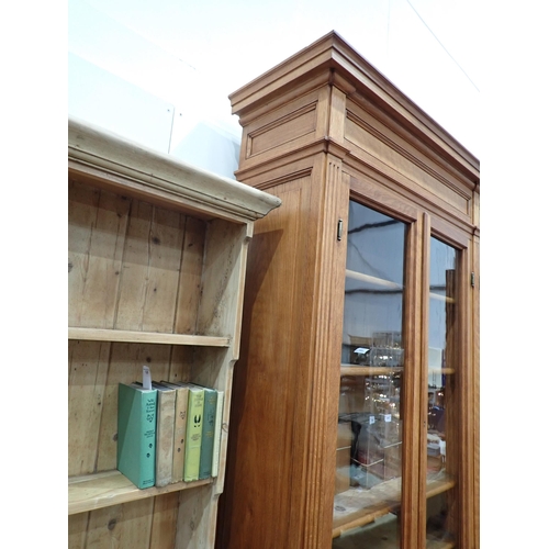 534 - A large French oak Bookcase, the upper section fitted four glazed doors enclosing adjustable shelves... 