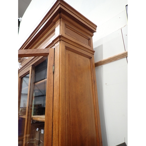 534 - A large French oak Bookcase, the upper section fitted four glazed doors enclosing adjustable shelves... 