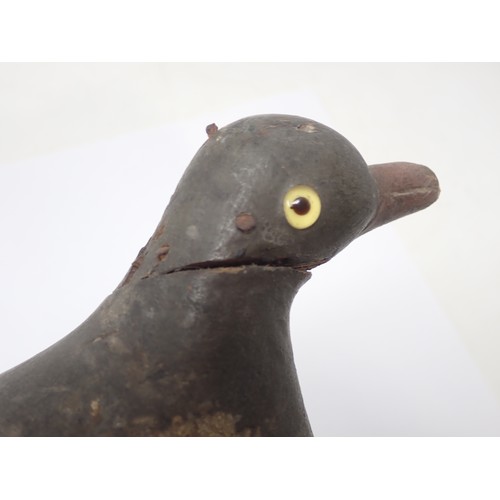 1358 - An antique wooden painted full bodied Pigeon Decoy with carved beak and inset glass eyes (A/F), 5 1/... 