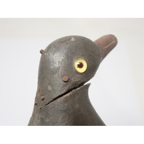 1358 - An antique wooden painted full bodied Pigeon Decoy with carved beak and inset glass eyes (A/F), 5 1/... 