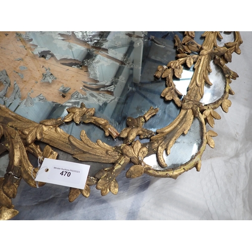 470 - An 18th Century giltwood framed Wall Mirror with circular leafage and pendant design, 4ft 3in x 2ft ... 