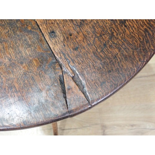 485 - An 18th Century country oak Pillar Table, the circular tilt top mounted on turned column and tripod ... 