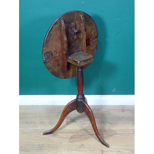 485 - An 18th Century country oak Pillar Table, the circular tilt top mounted on turned column and tripod ... 