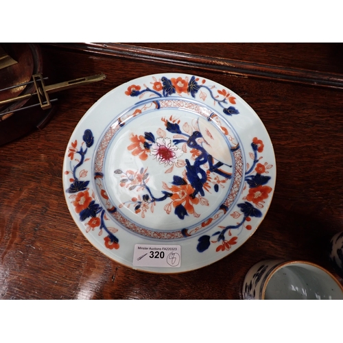 320 - Two Chinese Imari Plates painted landscape and flowering shrubs in iron red and blue, 9in, two imari... 