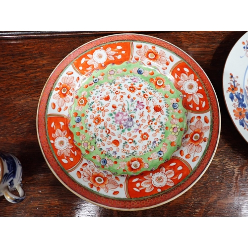 320 - Two Chinese Imari Plates painted landscape and flowering shrubs in iron red and blue, 9in, two imari... 