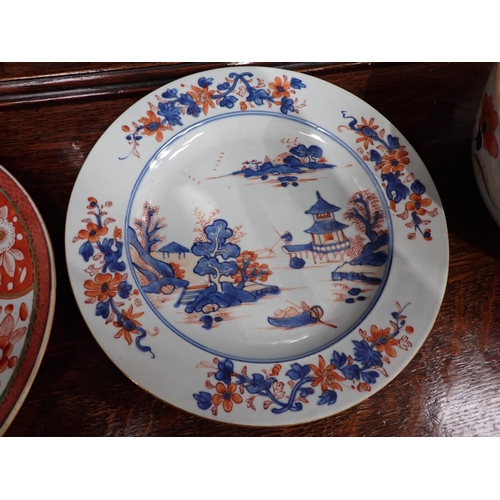 320 - Two Chinese Imari Plates painted landscape and flowering shrubs in iron red and blue, 9in, two imari... 