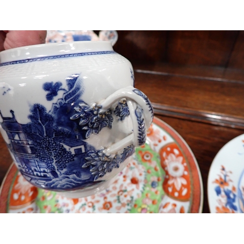 320 - Two Chinese Imari Plates painted landscape and flowering shrubs in iron red and blue, 9in, two imari... 