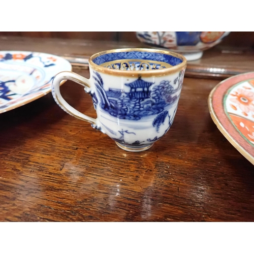 320 - Two Chinese Imari Plates painted landscape and flowering shrubs in iron red and blue, 9in, two imari... 