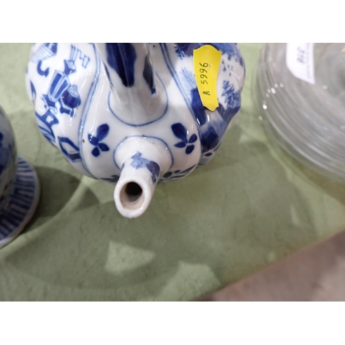 328 - An Oriental blue and white Ewer, floral painted, 6in, and a blue and white Teapot painted figures an... 