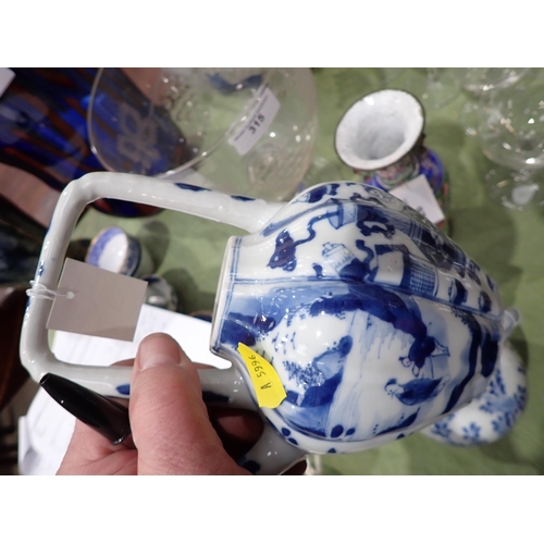 328 - An Oriental blue and white Ewer, floral painted, 6in, and a blue and white Teapot painted figures an... 