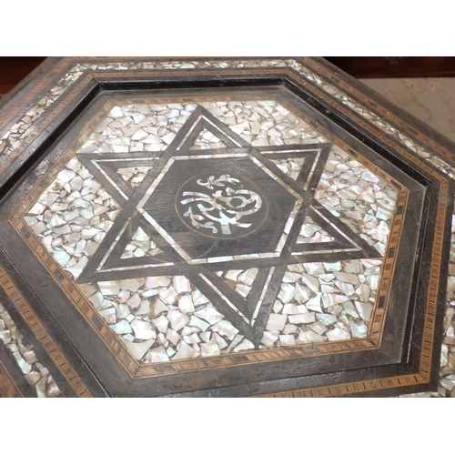 458 - A Moorish hardwood hexagonal Occasional Table, the top with star and central script motif, with all ... 