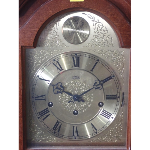 683 - A reproduction mahogany Wall Clock with arched brass dial, 2ft 11