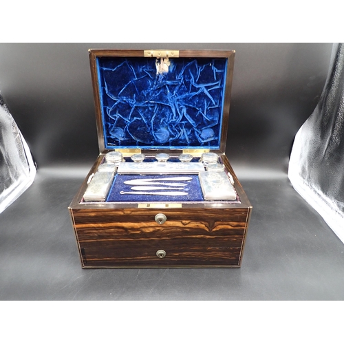 146 - A Victorian Coromandel Dressing Case containing silver lidded boxes and jars with finely engraved fl... 