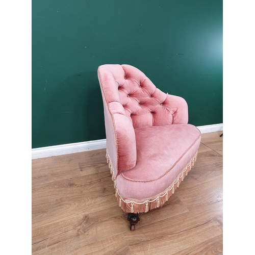 15 - A Victorian pink button upholstered Corner Chair with tassled fringe and raised on walnut scrolled f... 