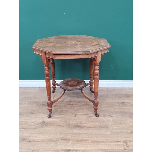 16 - An Edwardian rosewood octagonal Table with central floral inlay, raised on turned supports and caste... 