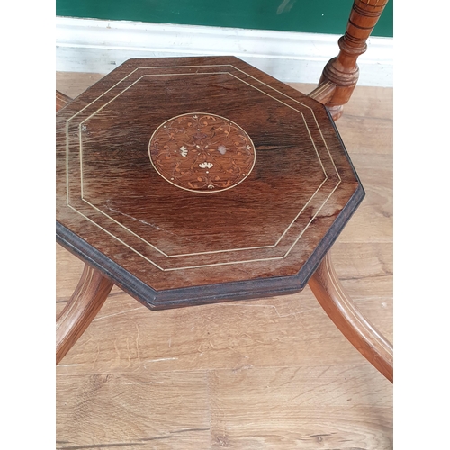 16 - An Edwardian rosewood octagonal Table with central floral inlay, raised on turned supports and caste... 