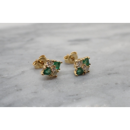 177 - A pair of Emerald and Diamond Ear Studs each claw-set three brilliant-cut diamonds and two step-cut ... 