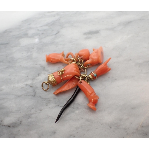 182 - A group of carved Coral Charms plus one Ebony Charm