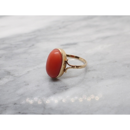 188 - A Coral Ring rubover-set oval cabochon, ring size M 1/2 - N