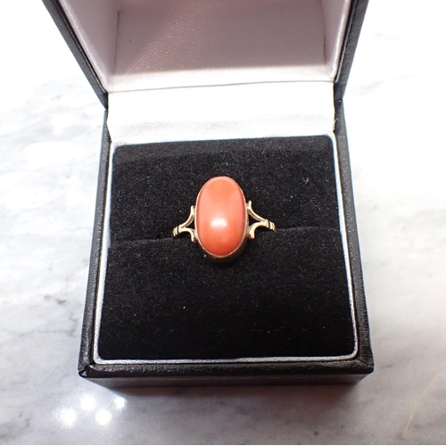 188 - A Coral Ring rubover-set oval cabochon, ring size M 1/2 - N