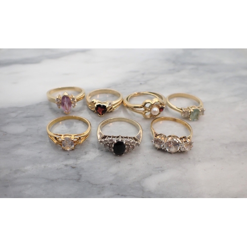 198 - Seven various silver-gilt and gilt metal Dress Rings set synthetic stones