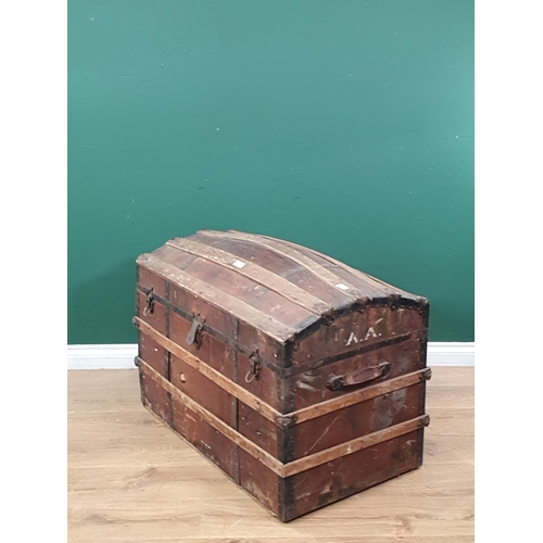 2 - A large wooden bound domed trunk with inner tray