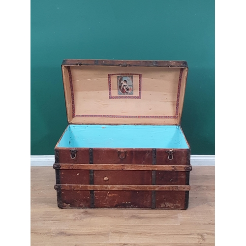 2 - A large wooden bound domed trunk with inner tray