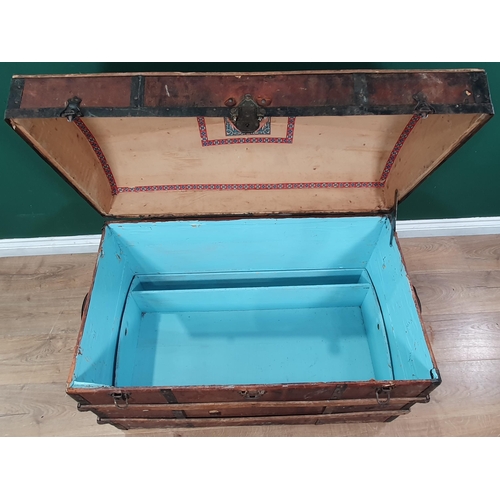 2 - A large wooden bound domed trunk with inner tray