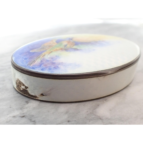 211 - An oval enamel silver-gilt Pill Box depicting pheasants to lid, 6.5cms wide, some damage to enamel