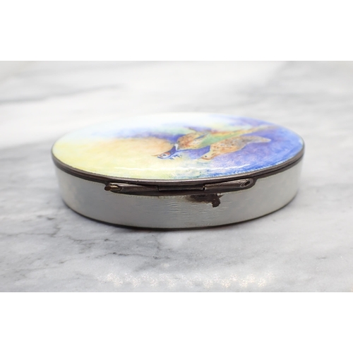 211 - An oval enamel silver-gilt Pill Box depicting pheasants to lid, 6.5cms wide, some damage to enamel