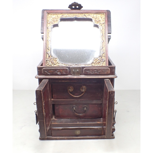 220 - A Chinese wooden and brass bound Jewel Chest fitted two drawers behind mirrored doors, drawer to bas... 