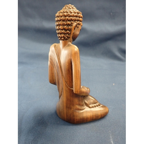 229 - A Balinese carved wooden God, signed I B Panca, 8in high