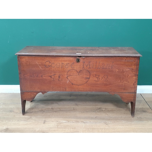 26 - An 18th Century elm Coffer with moulded hinged top and raised on shaped supports, later carved date,... 