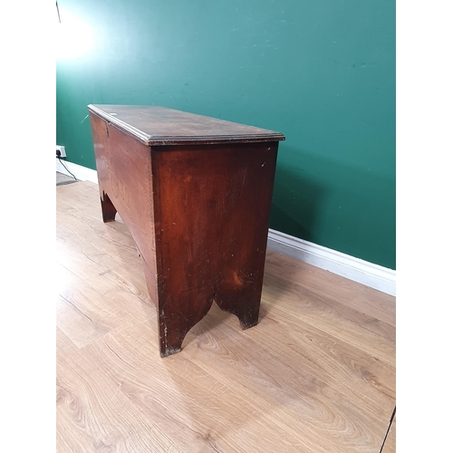 26 - An 18th Century elm Coffer with moulded hinged top and raised on shaped supports, later carved date,... 