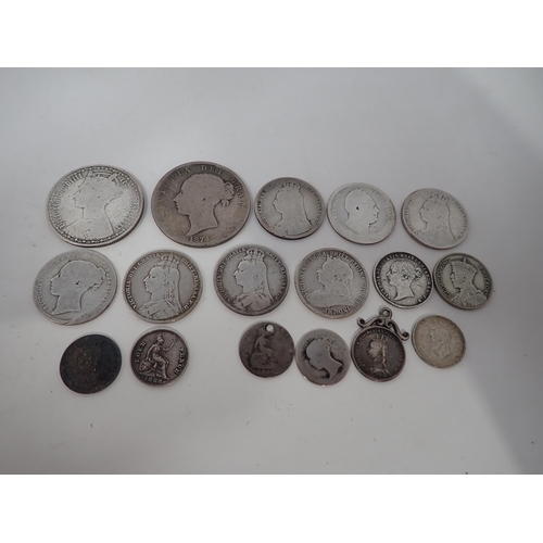 266 - A collection of British and World Coins, to include a Victorian Florin, Shillings, a 1797 Cartwheel ... 