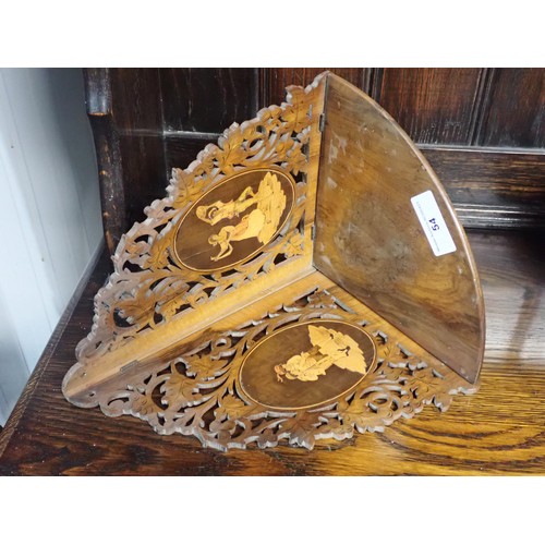 54 - A Continental walnut fret work Corner Shelf, inlaid oval panels of dancing figures, 14in