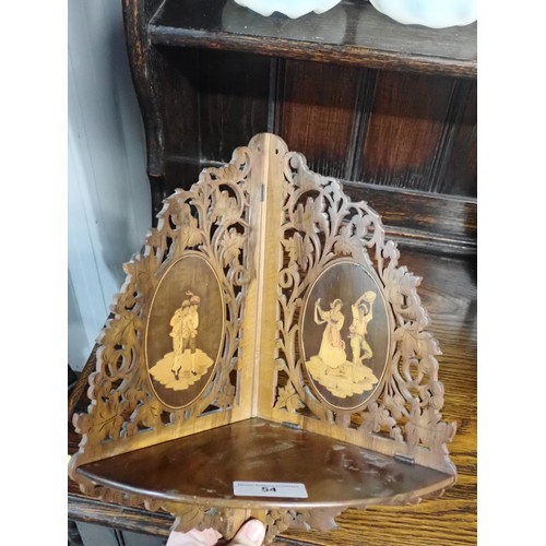 54 - A Continental walnut fret work Corner Shelf, inlaid oval panels of dancing figures, 14in