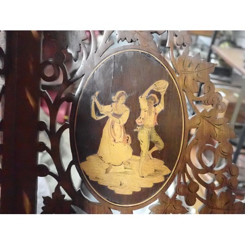 54 - A Continental walnut fret work Corner Shelf, inlaid oval panels of dancing figures, 14in