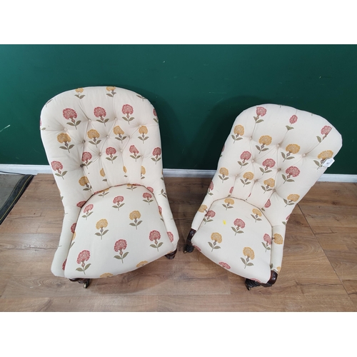 32 - A Victorian button upholstered Chair raised on baluster turned front supports  and casters and a Vic... 