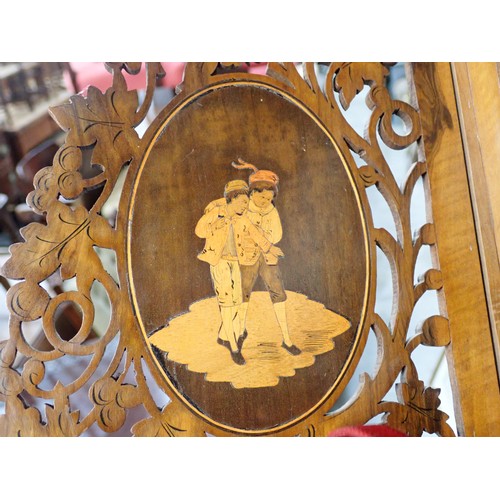 54 - A Continental walnut fret work Corner Shelf, inlaid oval panels of dancing figures, 14in