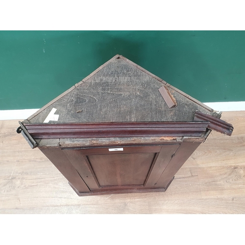 39 - A small antique oak hanging Corner Cupboard with inlaid panelled door enclosing shaped shelves, 2ft ... 