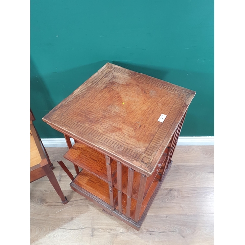 4 - An Edwardian Satinwood Revolving Bookcase with inlaid top on casters (A/F) 2ft 9