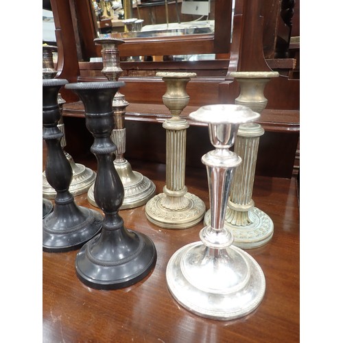 242 - A pair of brass Corinthian Candlesticks, a pair of plated Candlesticks, another plated Candlestick, ... 