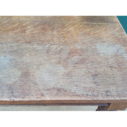 42 - A 19th Century oak Kitchen Table with plank top fitted frieze drawer (one frieze drawer missing) and... 