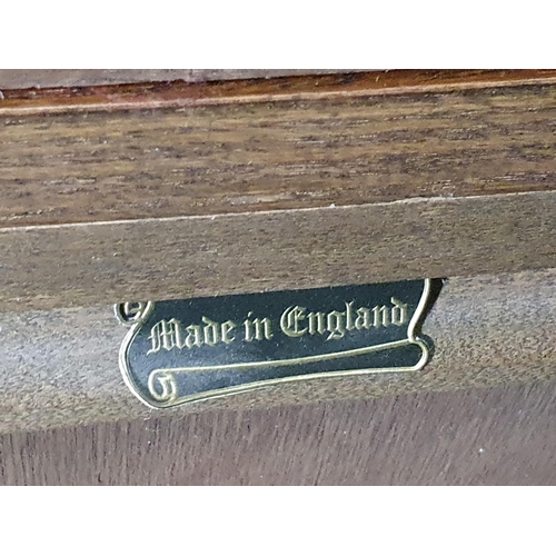 48 - An Old Charm oak Dresser and Rack fitted a pair of leaded glass doors above drawers and cupboards, 5... 