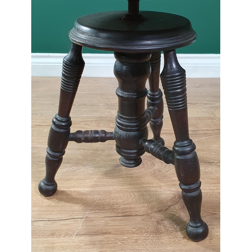 53 - An Aesthetic Movement style revolving Stool on three turned legs united by turned stretchers, The Ch... 