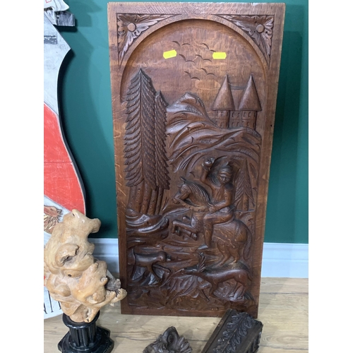 569 - A quantity of wood carvings including a carved Face on plinth, a Horse Hoof, a panel depicting figur... 