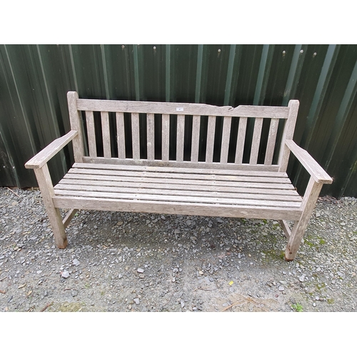 57 - A teak Garden Bench by Barlow Tyrie with slatted divisions, 5ft, top rail damaged