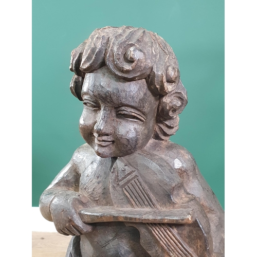 570 - A carved Sculpture of a Child Violinist on metal stand in the 18th Century style 2ft 5in H