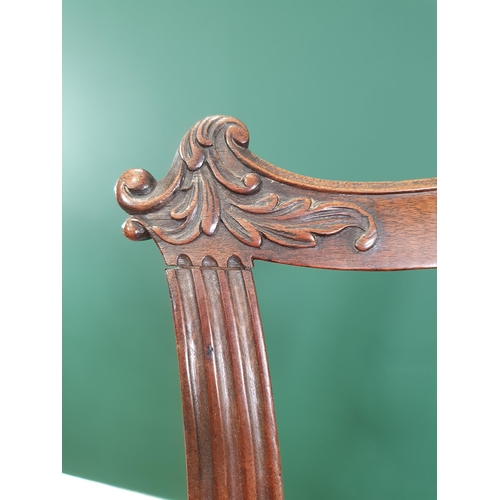 571 - A Georgian style mahogany Elbow Chair on carved cabriole supports and claw and ball feet, with exten... 